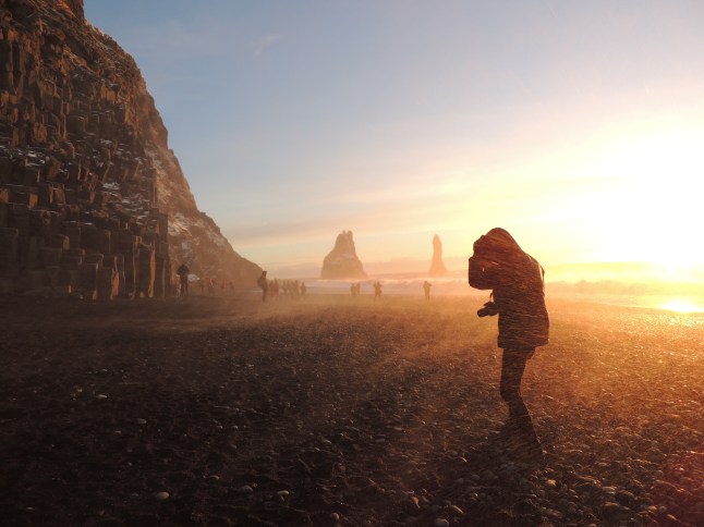 Wind storm during sunrise on the Black Sand Beach, Vik