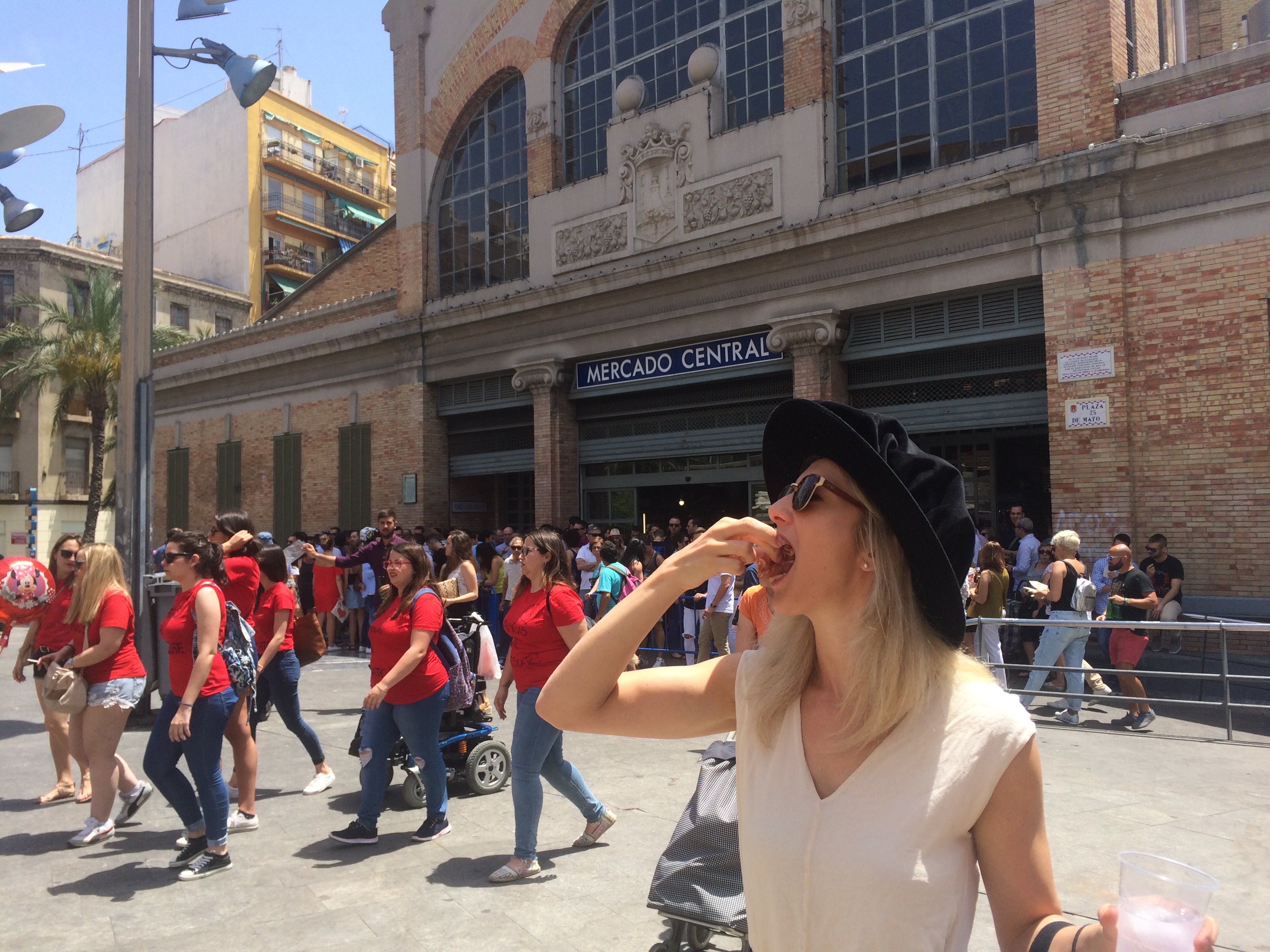 Devouring Jamon in Mercado Central in Cambridge Graduation (Dr!) hat!