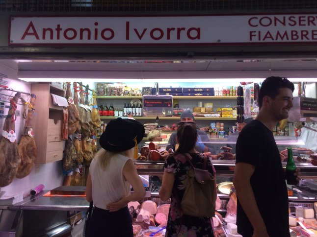 Choosing our Jamon platter in Mercado Central