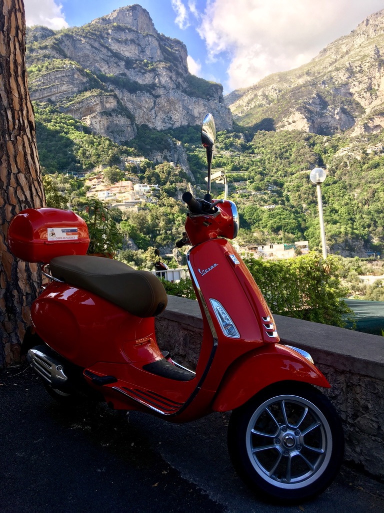 Vespa cliffside in Positano